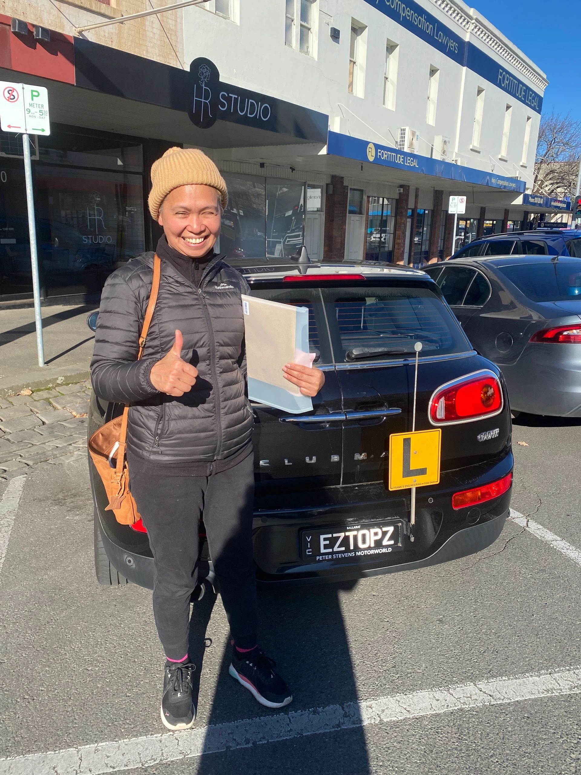 Student with instructor outside car